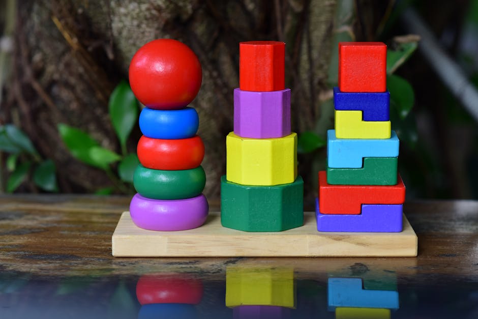 Vibrant wooden stacking toys arranged outdoors, encouraging creativity and learning.